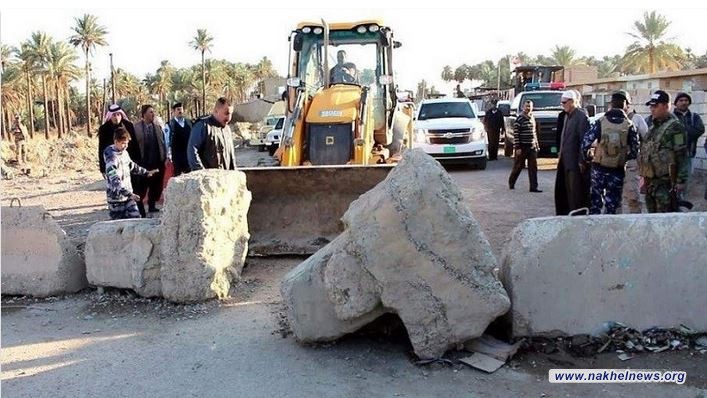 المرور تعلن رفع حواجز كونكريتية عن طريق في بغداد